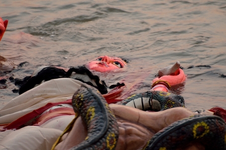 Immersion of goddess durga idol in river after completion of festivalの写真素材
