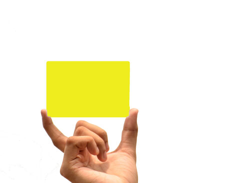 Holding yellow paper in white isolated backgroundの写真素材