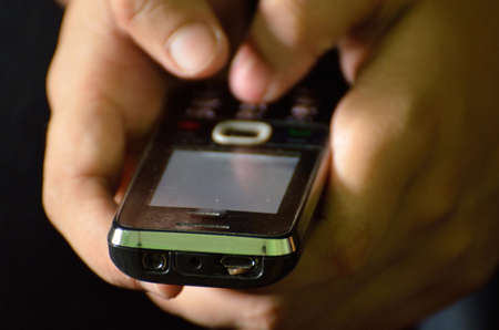 Human hands with mobile phone