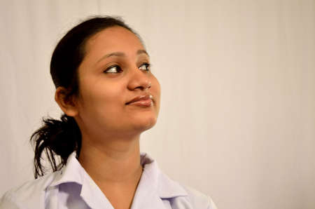 Young nurse smiling towards side