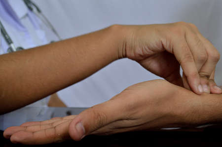 Pulse being taking on a middle aged manの写真素材