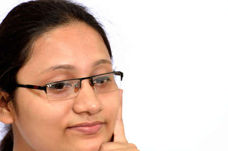 Girl thinking with smiling in a white background