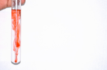 A boy was doing chemical reaction in a chemistry laboratoryの写真素材