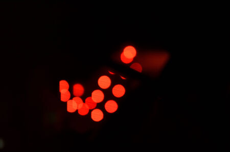 Christmas lights; bright glowing red holiday broke background