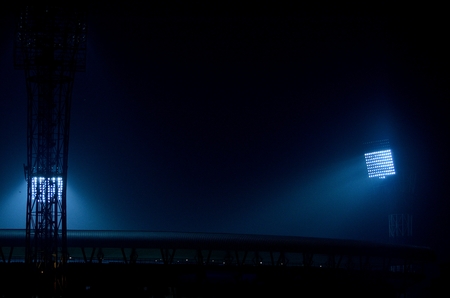 It situated at Kolkata, India. Stadium floodlights against a dark night sky background.  The picture is taken outside the stadium. From outside the stadium anyone can take the picture without any parmesan. I took the advantage and took the photograph.の写真素材