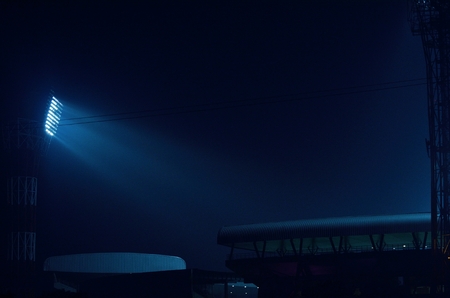It situated at Kolkata, India. Stadium floodlights against a dark night sky background.  The picture is taken outside the stadium. From outside the stadium anyone can take the picture without any parmesan. I took the advantage and took the photograph.の写真素材