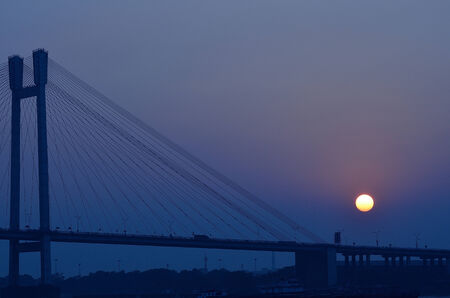Sunset over a bridge.の写真素材