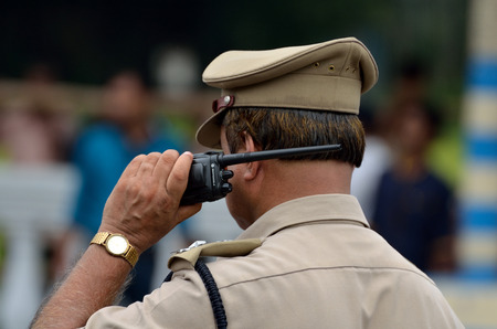 Indian police talking with walkie talkiesのeditorial素材