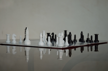 Chess pieces on chess board in black and white.の写真素材