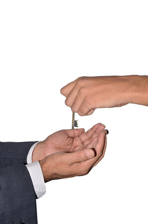 man giving key into another handの写真素材