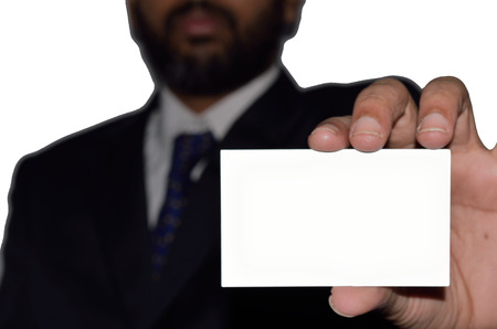 A Indian businessman displaying a blank card