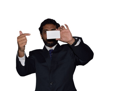 A Indian businessman displaying a blank cardの写真素材
