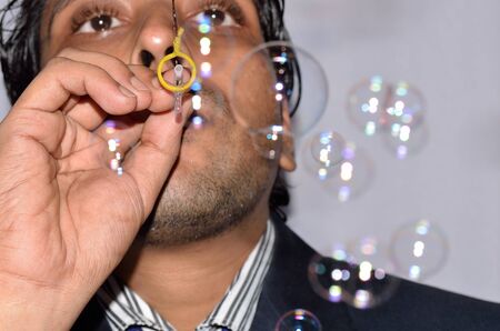 Man blowing balloon