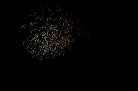 Fireworks display in night sky during new year celebration.