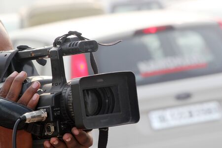 A video journalist operate video camera.の写真素材