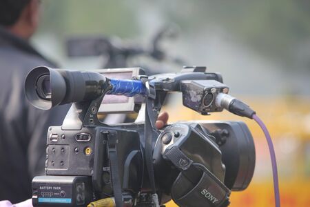 A video journalist operate video camera.の写真素材