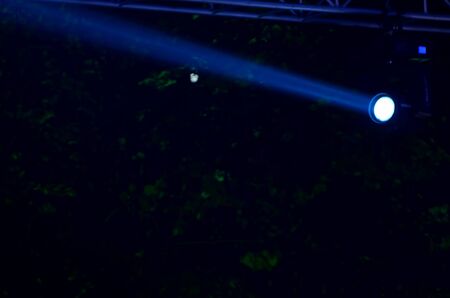 Beam of blue light on black . Applied to a searchlight torch.の写真素材