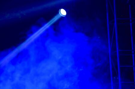 Beam of blue light on black . Applied to a searchlight torch.の写真素材
