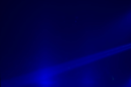 Beam of blue light on black . Applied to a searchlight torch.の写真素材