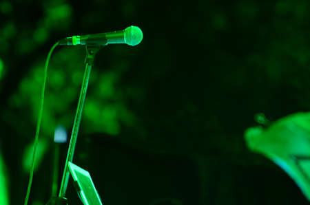 Close-up of microphone in green light.の写真素材