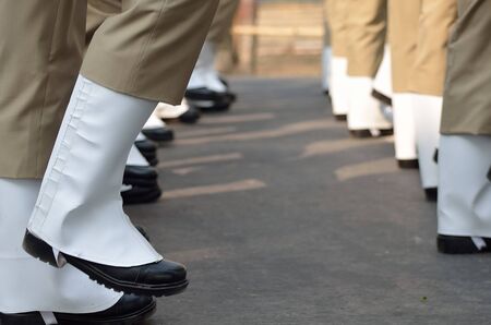 Soldiers marching in row.