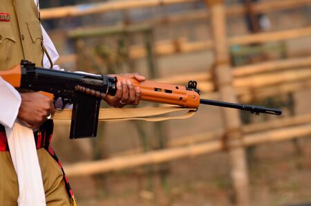 Indian army man is walking with gun at Calcutta.の写真素材