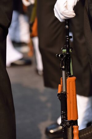 Indian army men standing with gun
