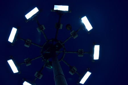 Lighting tower from low angle in a night.の写真素材