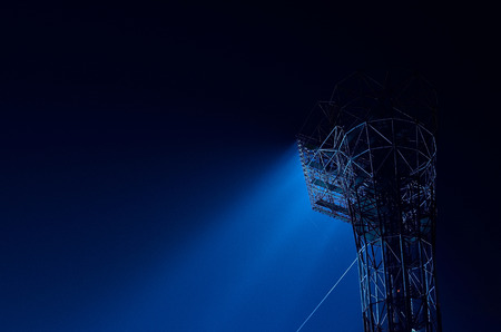 Stadium floodlights against a dark night sky backgroundの写真素材