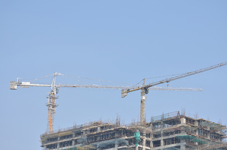 Cranes in a construction site.の写真素材