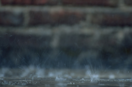 Close-up of raindrops in a building roof.