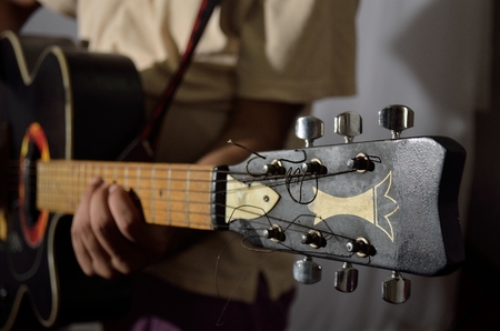 A guitarist playing acoustic guitar.の写真素材