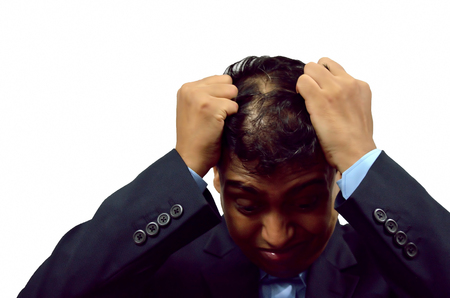 Closeup image of a frustrated man.の写真素材