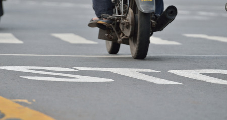 Bike is moving over zebra crossingの写真素材