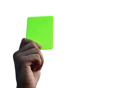 Hand holding a green card in white background.の写真素材