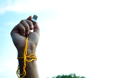 Referre raised hand with whistelの写真素材