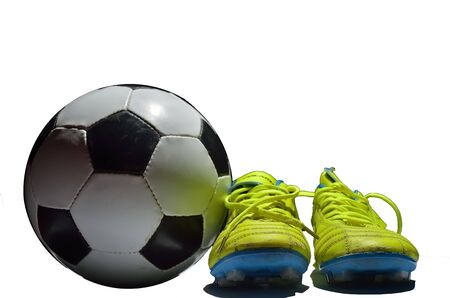 Soccer ball and cleats on white backgroundの写真素材