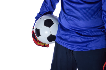 One soccer player goalkeeper standing with holding ball in white background.の写真素材