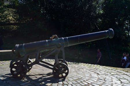 View of Nelson's Monument Park in Edinburgh, Scotland. There is a cannon pointing at the Dugald Stewart Monument.のeditorial素材