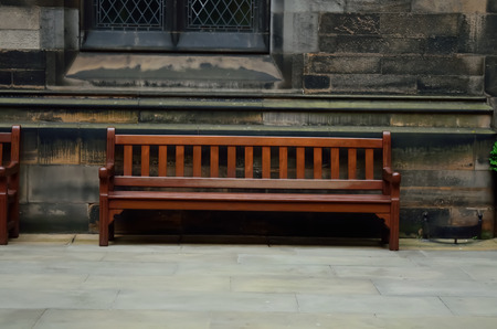 Rusty wooden bench in a lobby.の写真素材