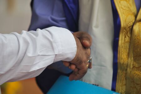Two men are shaking hands.They agree with their viewpoint.So they shaking hand.
