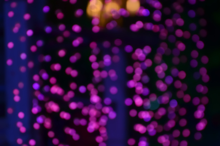 Photo showing a defocused light. Defocused violated color light in a public place in public festival.の写真素材