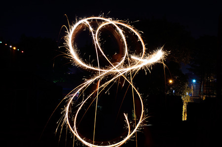 Sparkling fireworks in black background.の写真素材