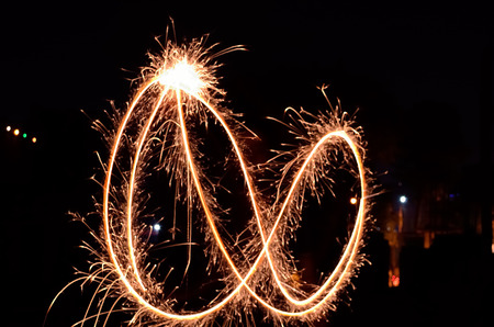 Sparkling fireworks in black background.の写真素材