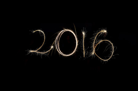 2016 with fireworks in a black background.の写真素材