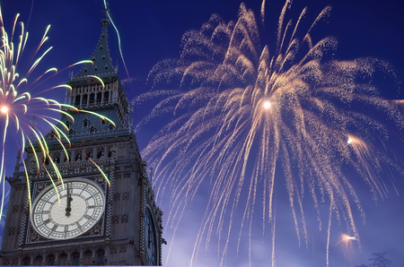 12 O'Clock in Big Ben, Fireworks are displayed on sky to celebrate new year.の写真素材