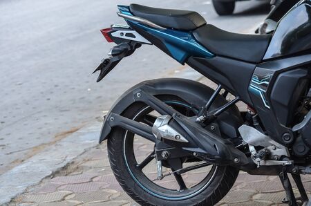 Motorbike is parted beside street.の写真素材