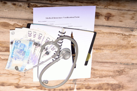 British currency for health insurance form fill-up.