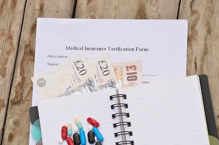 British currency for health insurance form fill-up.