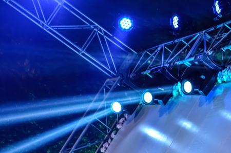 Beam of stage light for live performance on black background.